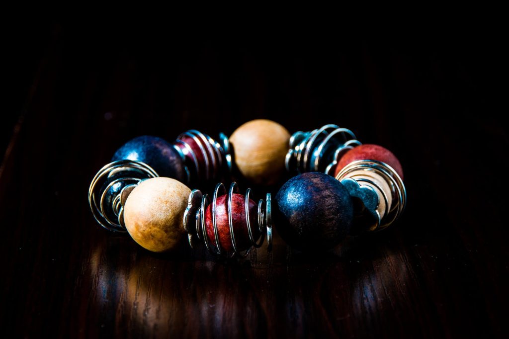 blue red beige and silver beaded bracelet