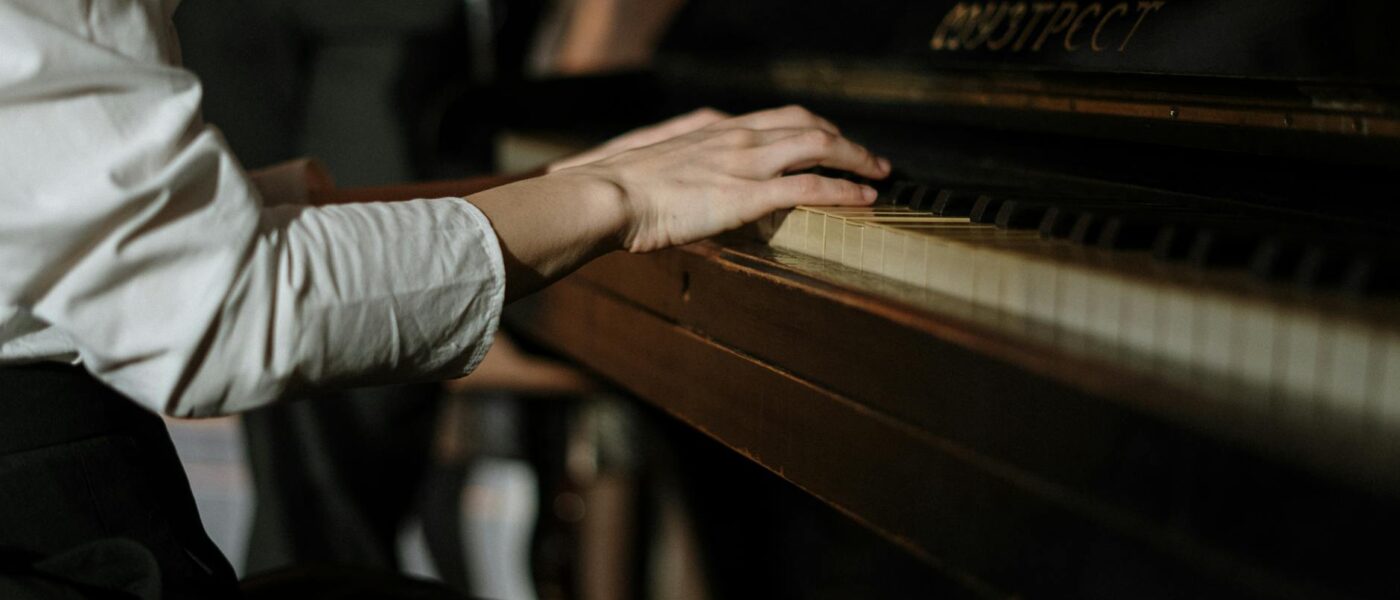hands sitting music piano