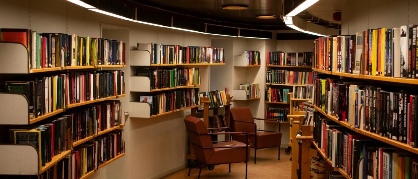 chair beside book shelves