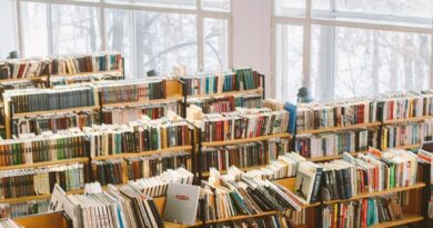 books on brown wooden shelf