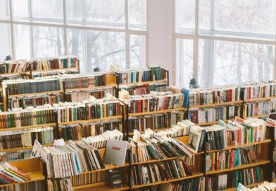 books on brown wooden shelf