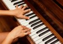 close up photo of person playing piano