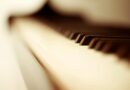 white and black piano keys in blurry photo