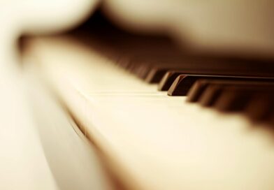 white and black piano keys in blurry photo