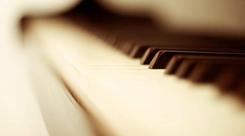 white and black piano keys in blurry photo