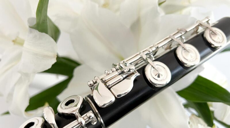 photo of a flute near white lilies