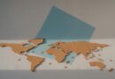 cork world map on blue paper