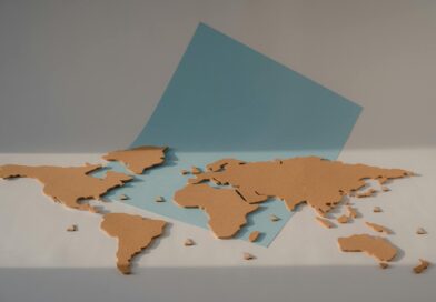 cork world map on blue paper
