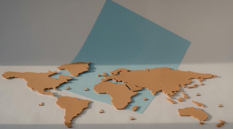 cork world map on blue paper