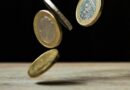 coins on brown wood