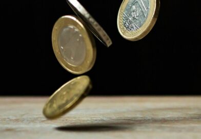 coins on brown wood