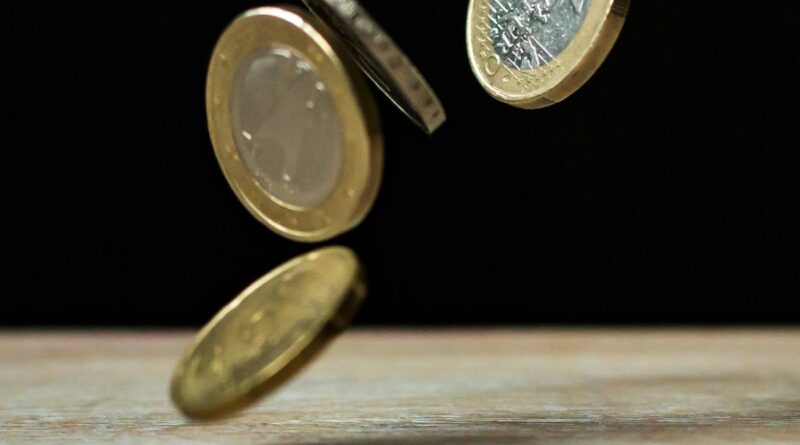 coins on brown wood