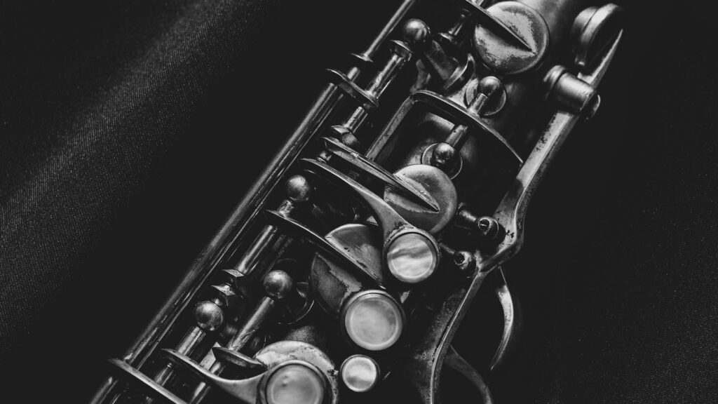 black and silver trumpet on black textile